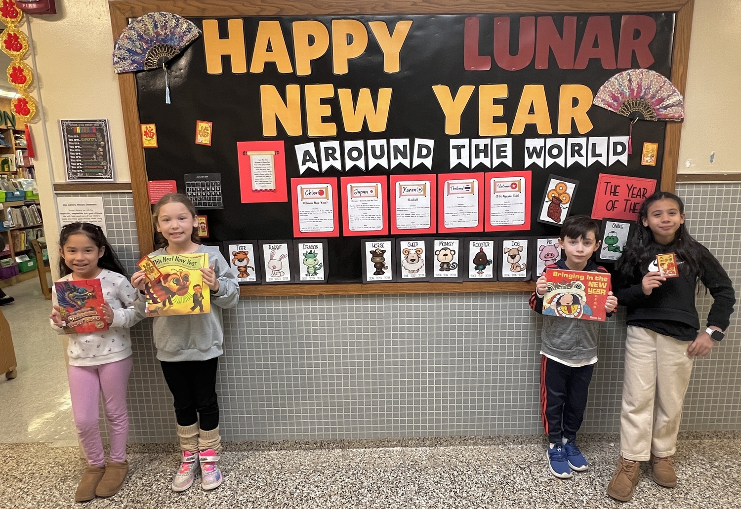 To celebrate Lunar New Year, Westhampton Beach Elementary School students in kindergarten through grade five are learning about the customs and traditions surrounding the holiday. They have studied the dragon parade, lion dances and lantern festivals. From left, students Alexandra Muralles, Ella Byrnes, Dante Aiello and Emma Salazar. COURTESY WESTHAMPTON BEACH SCHOOL DISTRICT