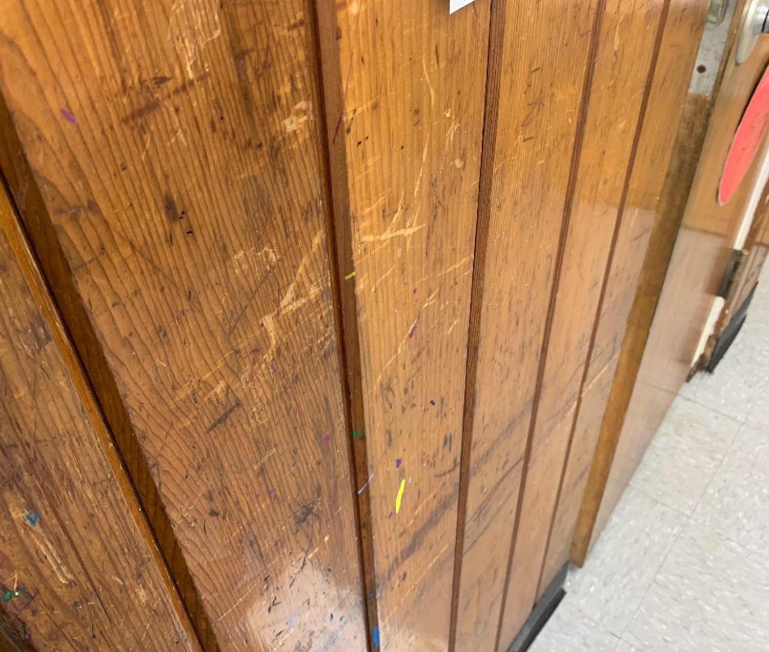 Wood paneling throughout the building is stained and scratched. SPRINGS SCHOOL DISTRICT