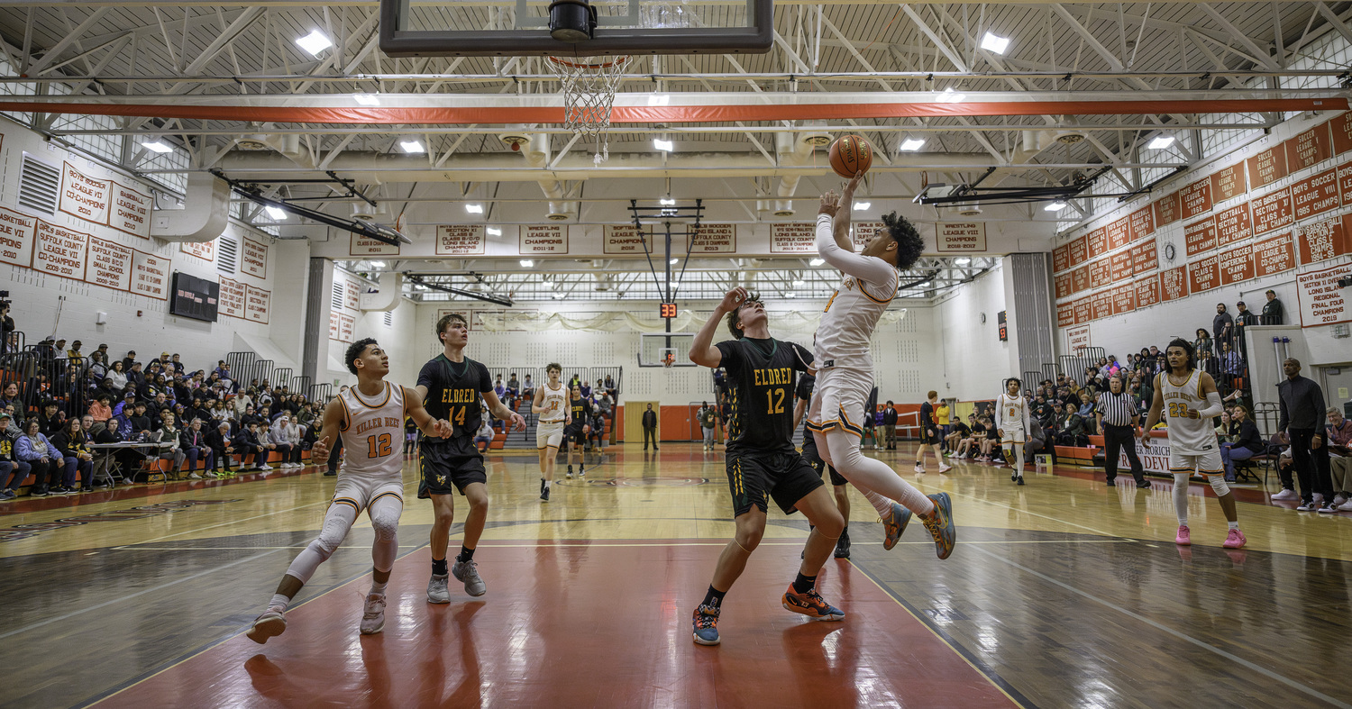 Alex Davis goes baseline to score in the final seconds of the third quarter.   MARIANNE BARNETT