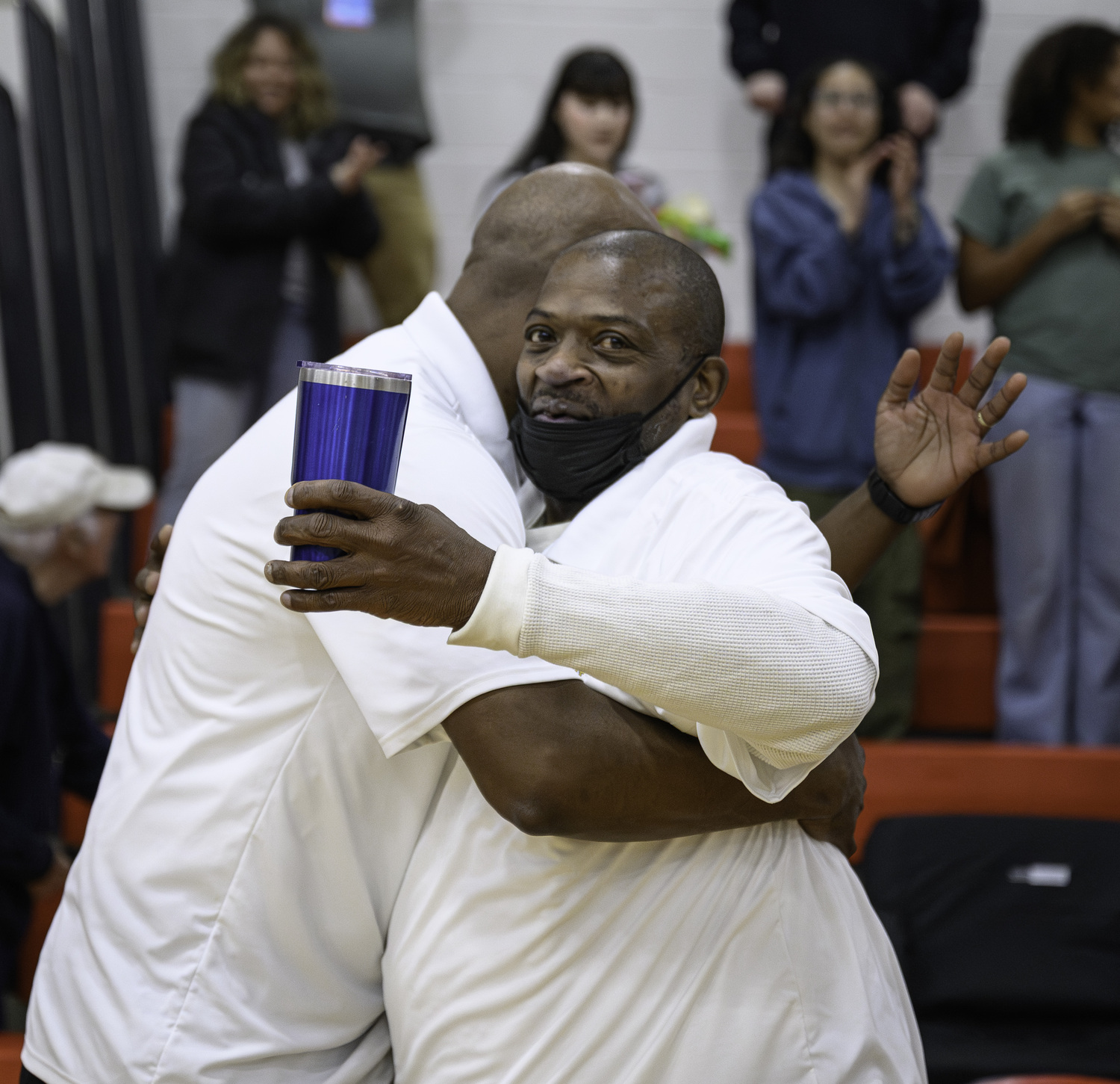 Bridgehampton coached Eddie Dawson, left, and Troy Bowe hug as their team wins Saturday's Regional Final.   MARIANNE BARNETT