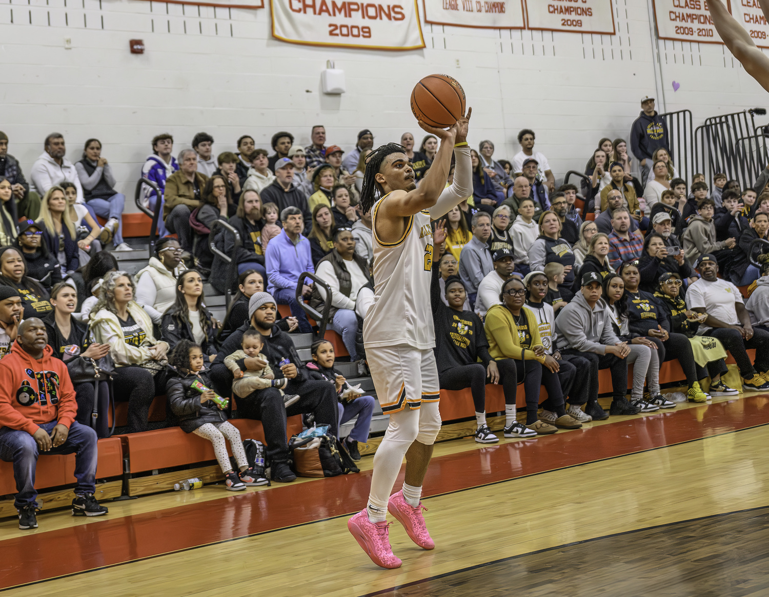 Bridgehampton senior Jaylen Harding shoots a three-pointer in front of the Bridgehampton crowd at Center Moriches High School on Saturday.  MARIANNE BARNETT