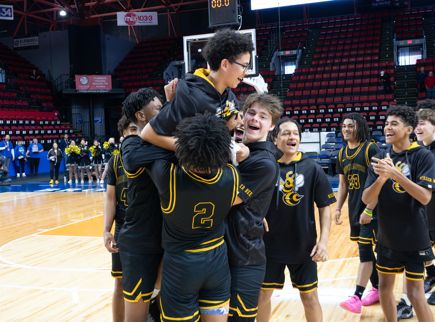 The Bees hoist up Miczar Garcia after he was given the team's sportsmanship award.  RON ESPOSITO