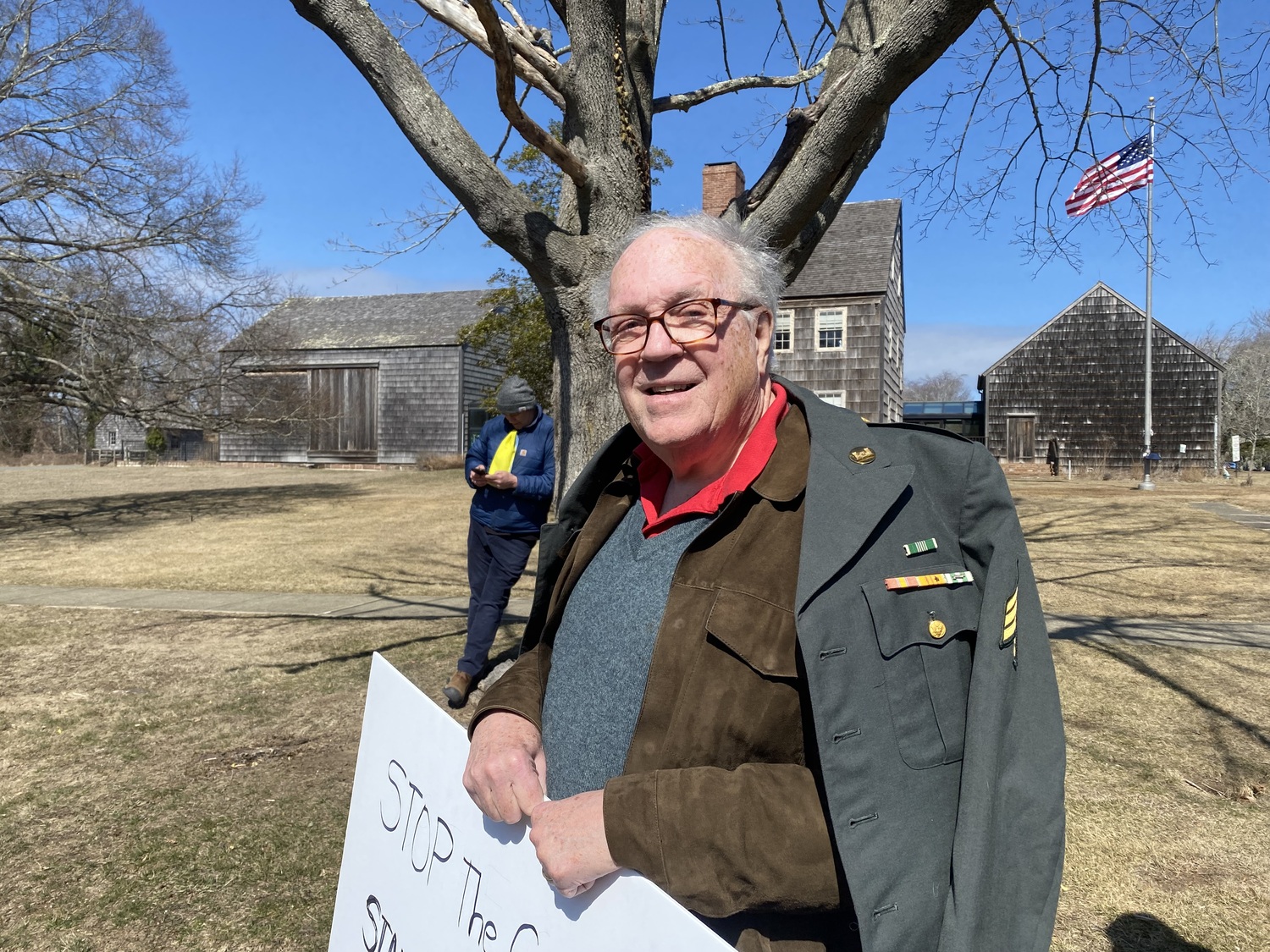 Vietnam War veteran Bob Pine attended a demonstration on the road outside East Hampton Town Hall on Friday, March 14. JACK MOTZ