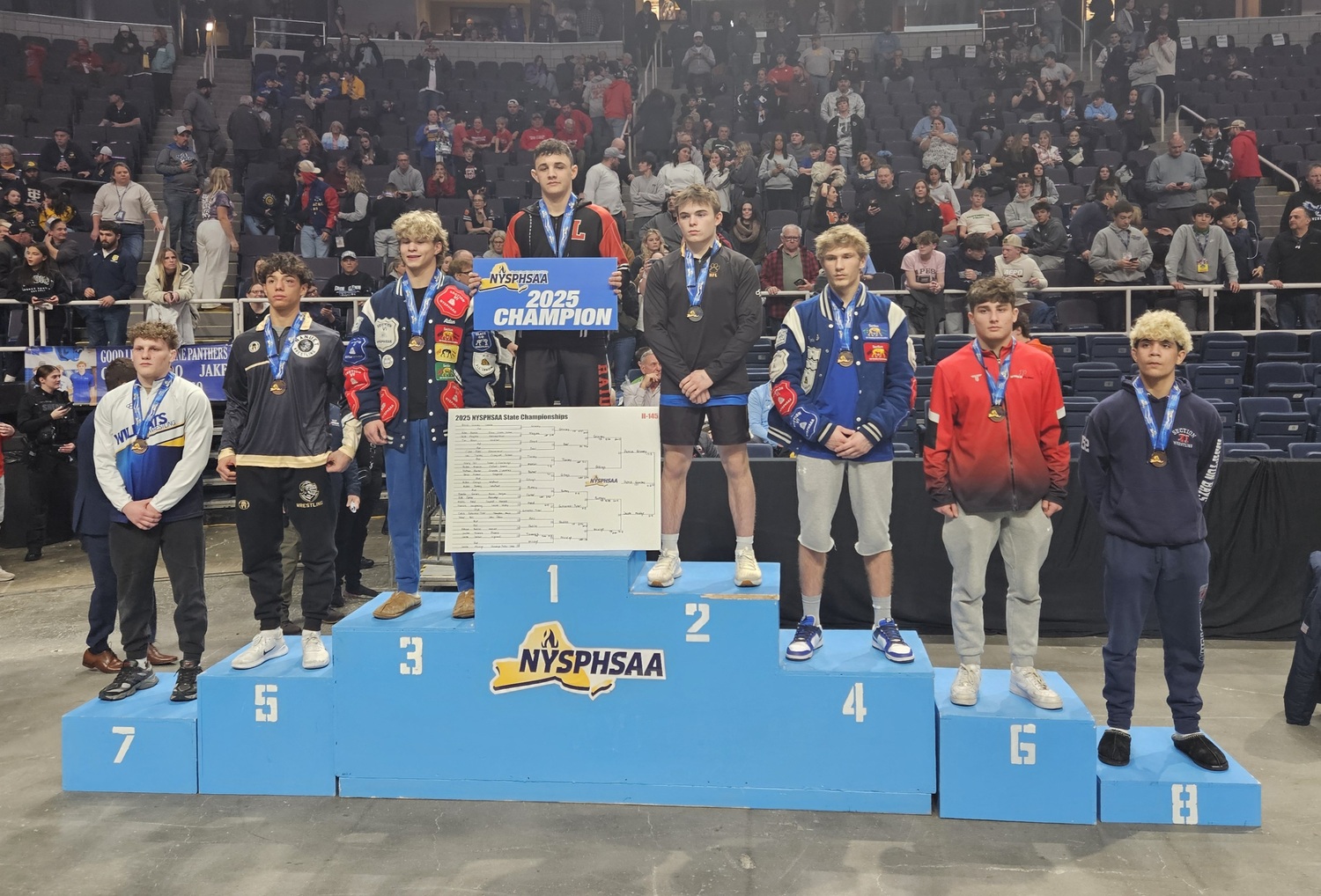 Cyrus Gutierrez-Tyler, far right, placed eighth and is the first Hampton Bays wrestler to earn All-State honors since Dom Mustacio in 2006.   COURTESY MIKE LLOYD