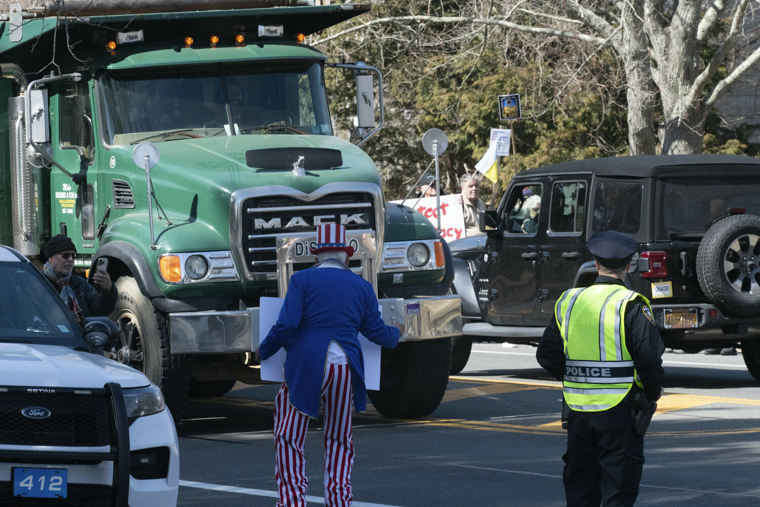 Protesters gather outside East Hampton Town Hall on March 14.  DOUG KUNTZ