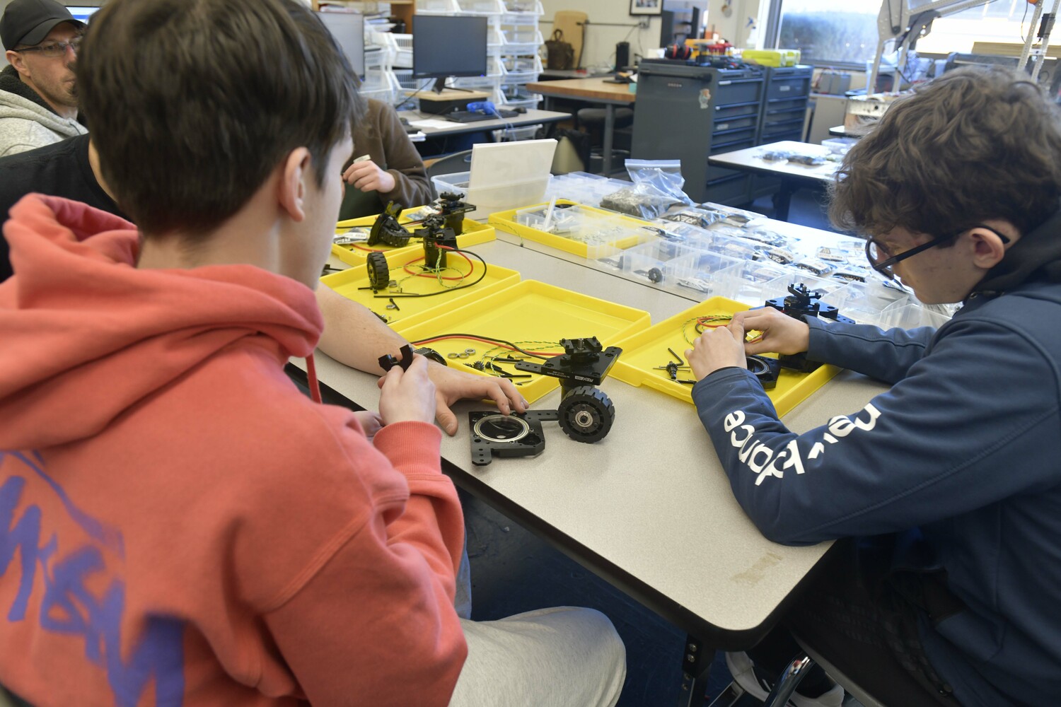 Emir Bedrolli and Jacob Warden work on a bot. DANA SHAW