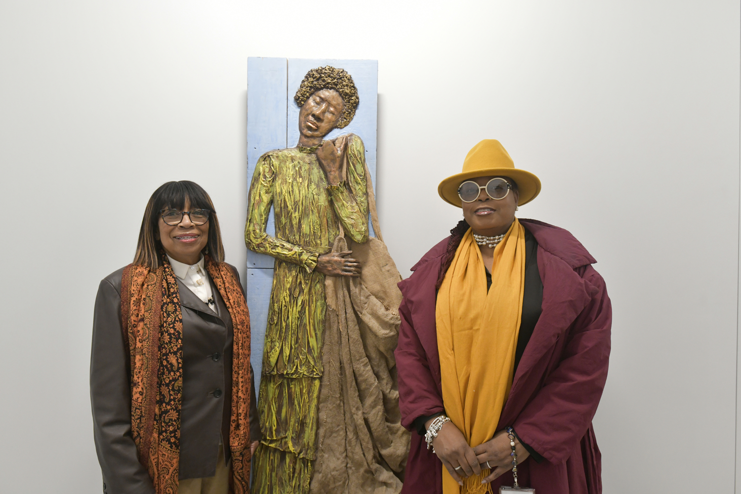 Debbie Woods and Dr. Georgette Grier-Key at the opening of “Both/And: An Exploration of the Identities of Being Black and a Woman in the United States” on February 26, at the Southampton African American Museum.    DANA SHAW