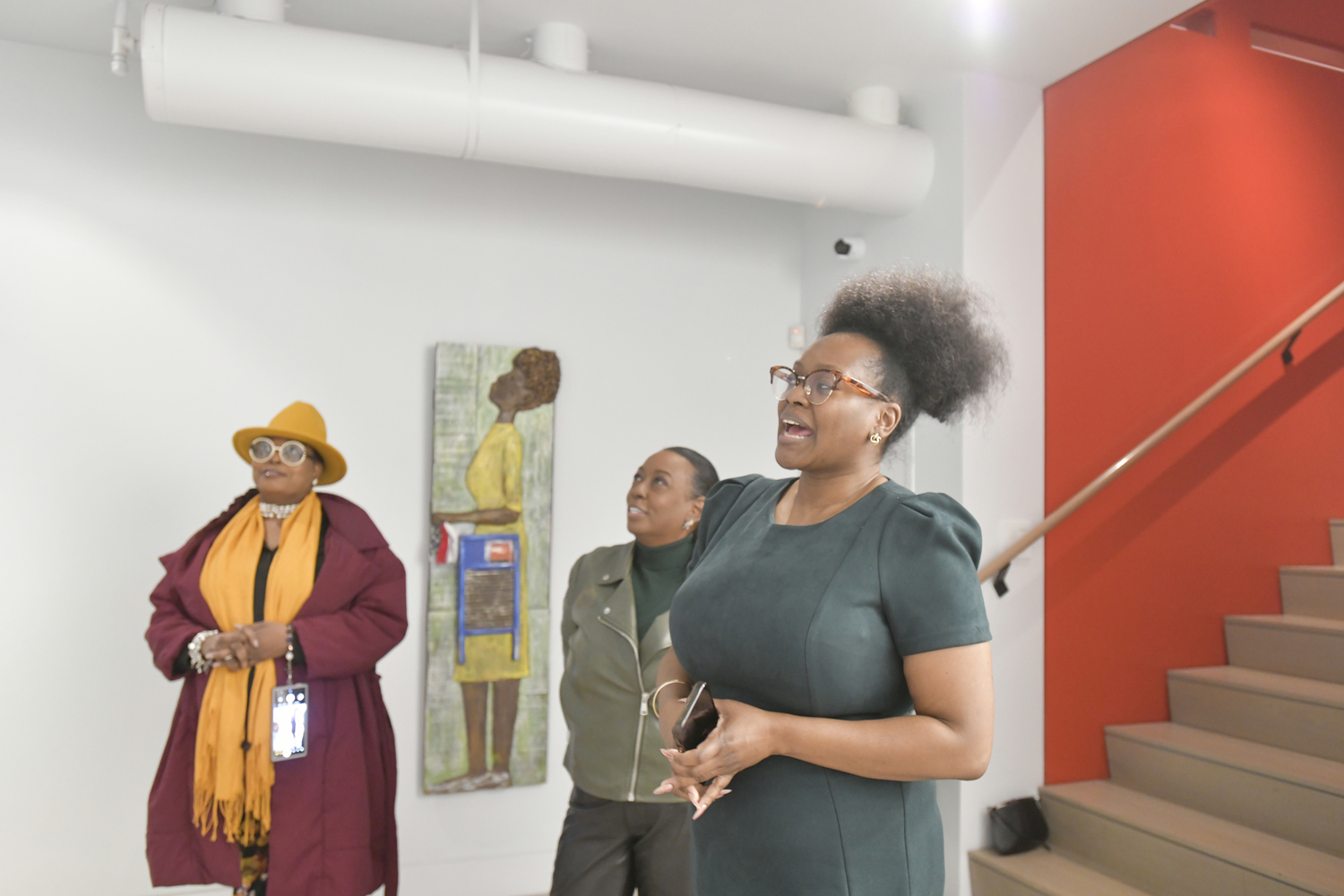 SAAM Executive Director Jessica Elliot welcomes visitors to the opening of “Both/And: An Exploration of the Identities of Being Black and a Woman in the United States” on February 26, at the Southampton African American Museum.    DANA SHAW