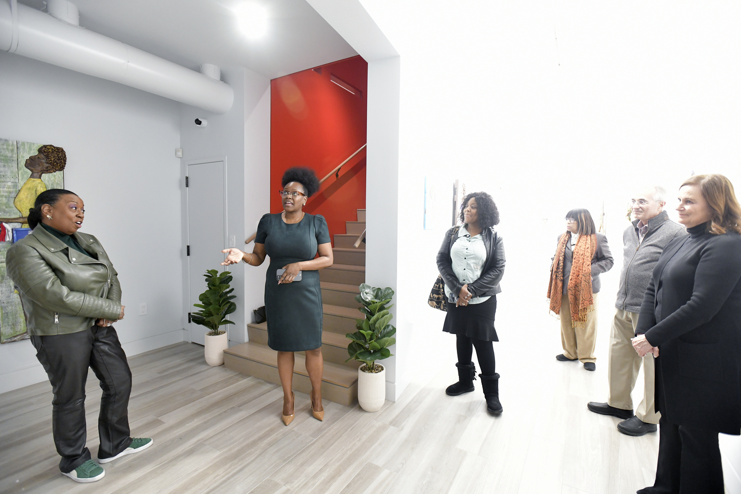 SAAM Executive Director Jessica Elliot welcomes visitors to the opening of “Both/And: An Exploration of the Identities of Being Black and a Woman in the United States” on February 26, at the Southampton African American Museum.    DANA SHAW