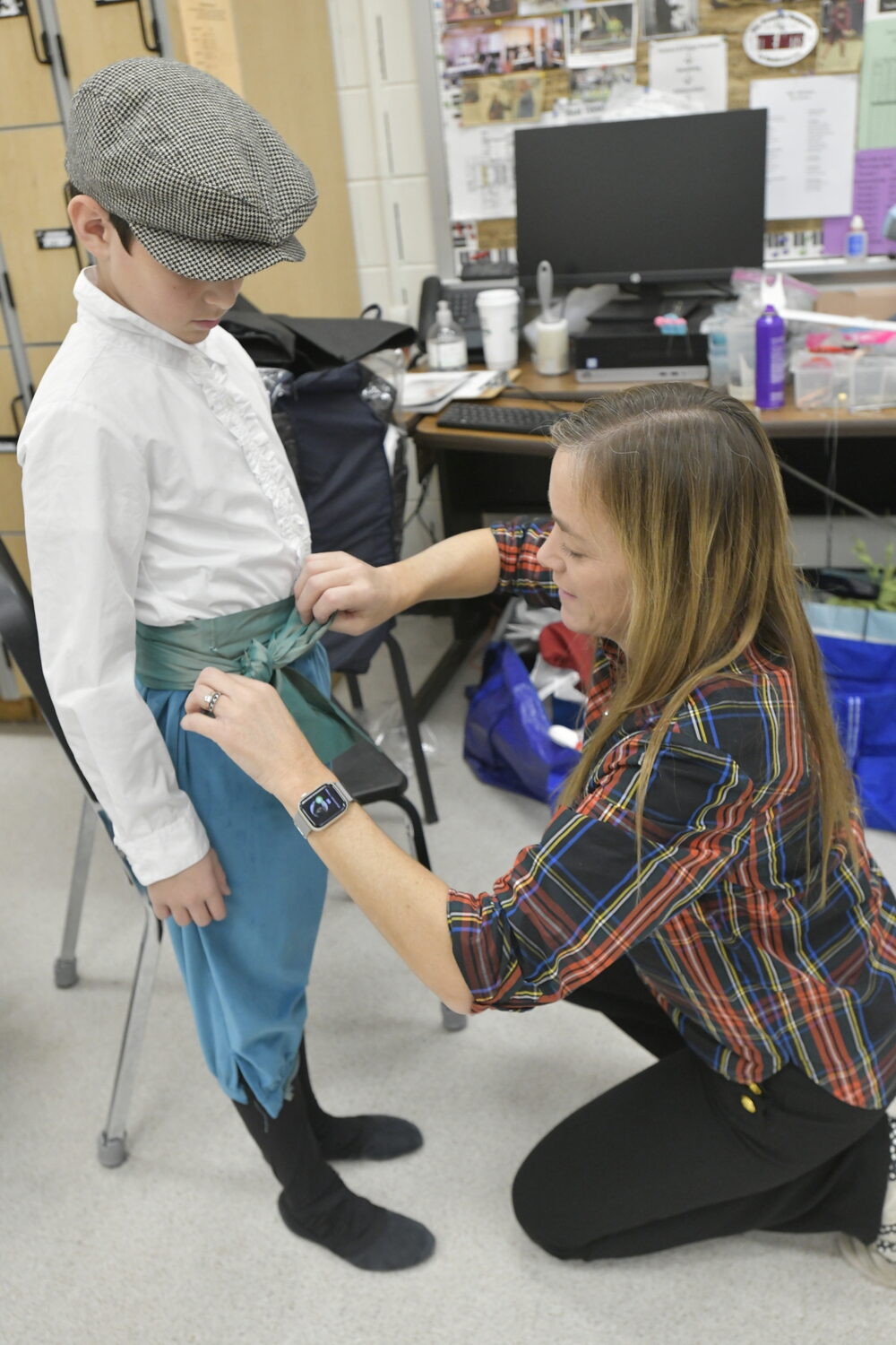 Ammiel Sobey gets help with his costume from Kate Mc Manus.