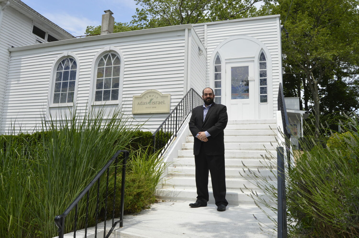 Rabbi Daniel Geffen in front of Temple Adas Israel in Sag Harbor.