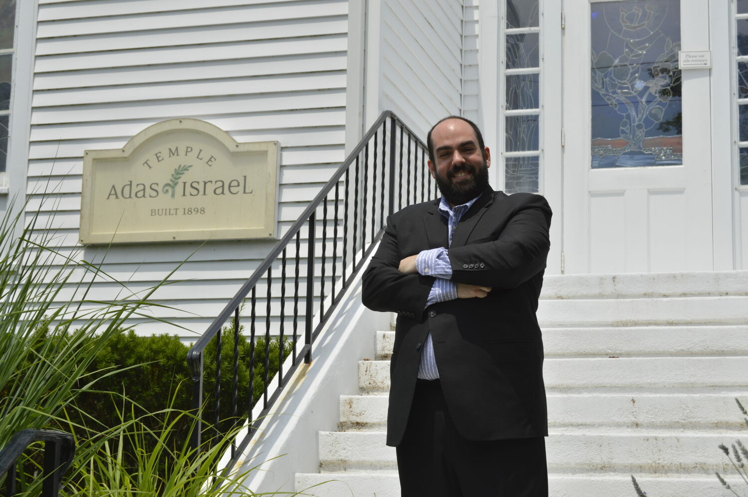 Rabbi Daniel Geffen in front of Temple Adas Israel in Sag Harbor.