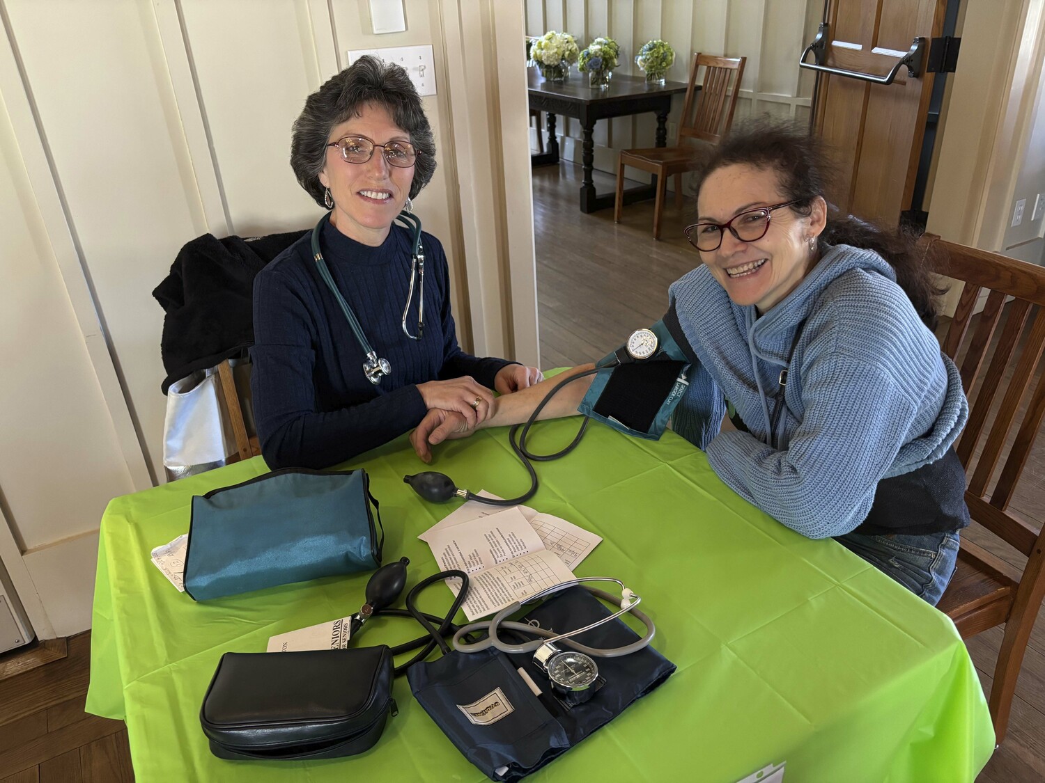 Anne Scharfenberg, RN WITH Melba Lucia Garcia at the East Hampton Healthcare Foundation's Free Community Health Fair in Hoie Hall at St. Luke's Episcopal Church in East Hampton. Representatives from local health organizations shared information about their services.   RICHARD LEWIN