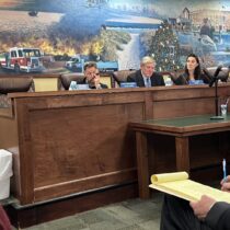 The three memebers of the Westhampton Beach Village Board lsten to comments during the public hearing to ratify the solar lease with CVE North America for a planned solar farm on village property on Quiogue. BILL SUTTON