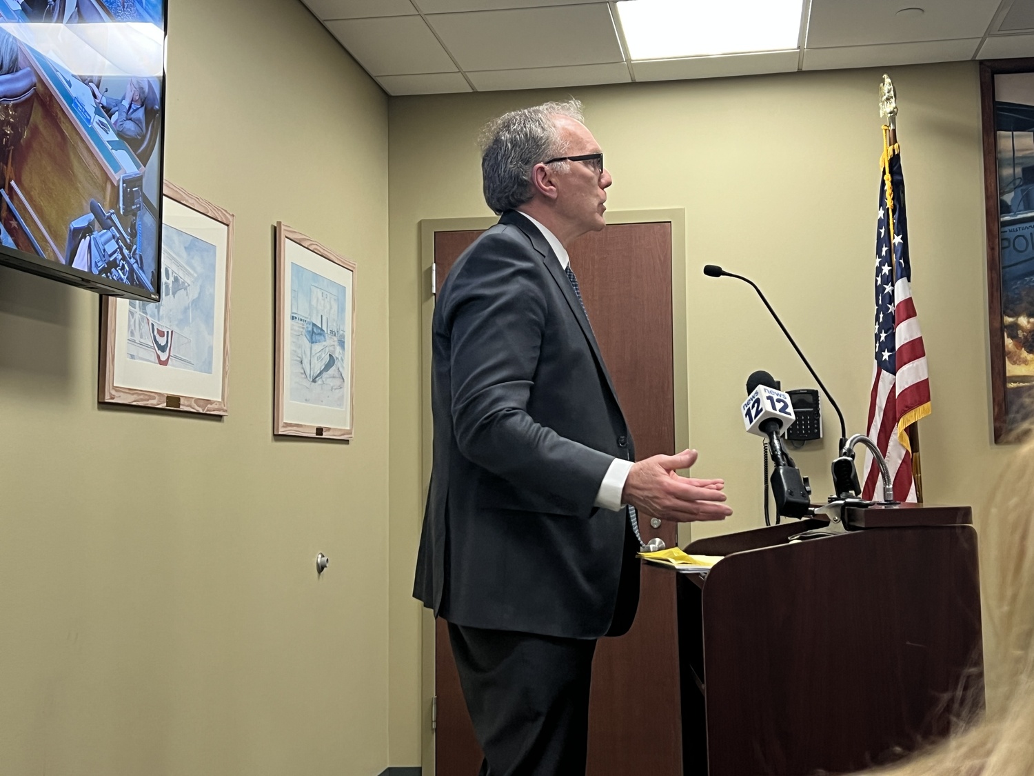 Attorney John Lynch, who also lives near the property, addresses the Village Board last week, urging members to reject a lease with CVE North America for a solar array on Quiogue. BILL SUTTON