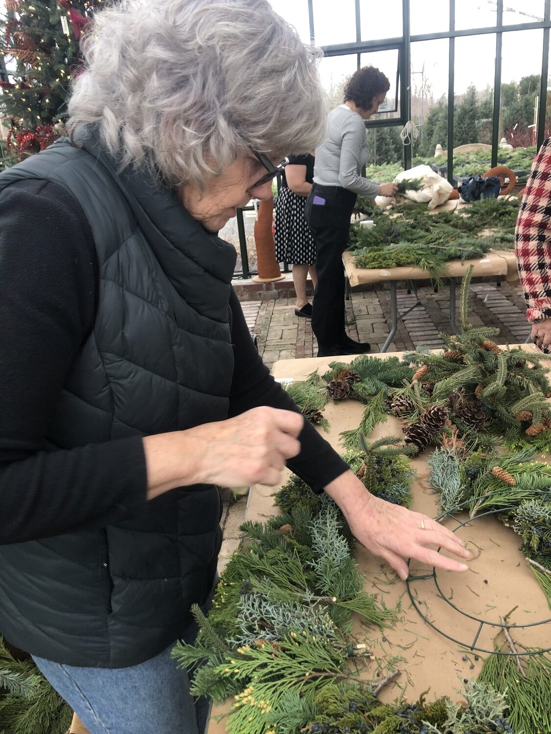 Denise Kelly teaches the wreath-making class at Marders. CAILIN RILEY