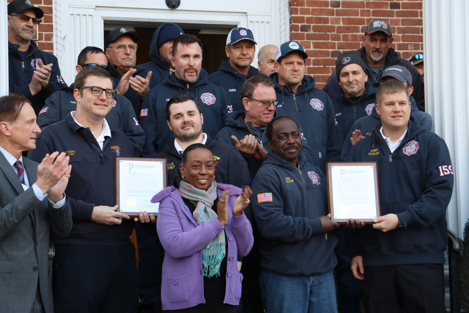 The Southampton Village Board presented members of the Southampton Fire Department with a proclamation on Thursday evening on the steps of village hall, honoring them for their efforts in fighting the Westhampton wildfires. Each member of the department was treated to a free beer at Fellingham's. CAILIN RILEY PHOTOS