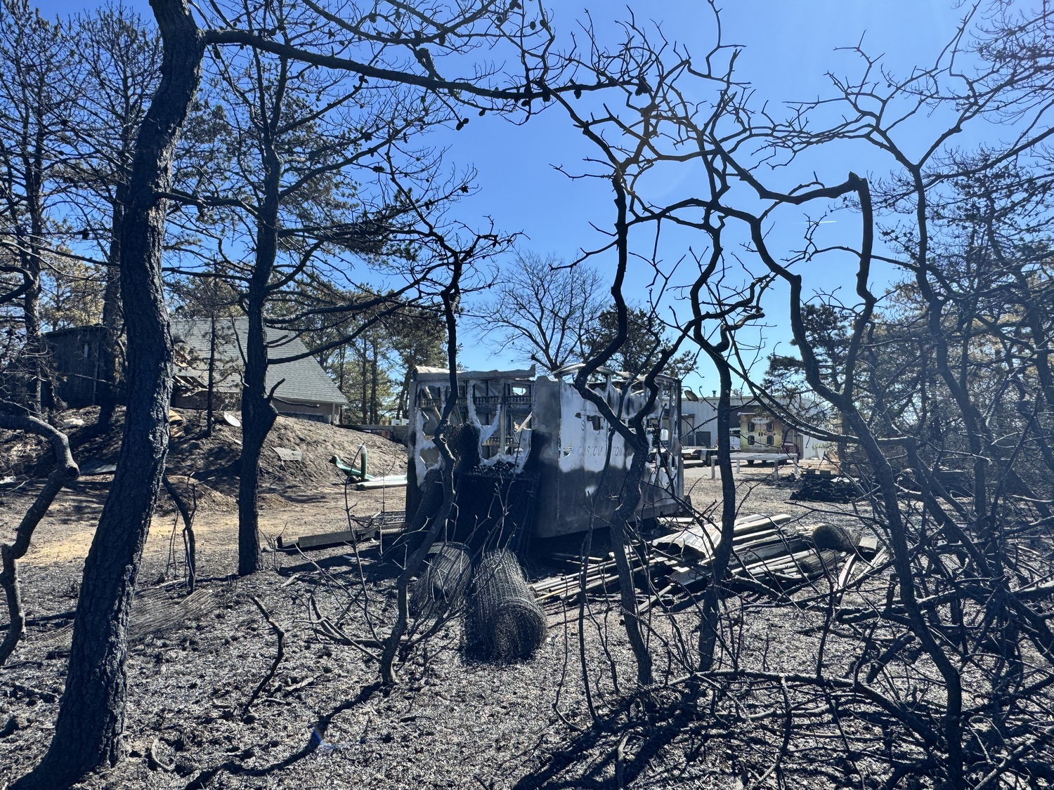 The fire destroyed a storage trailer and badly damaged a barn at AutoGate Systems on Old Riverhead Road in Westhampton. MICHAEL WRIGHT