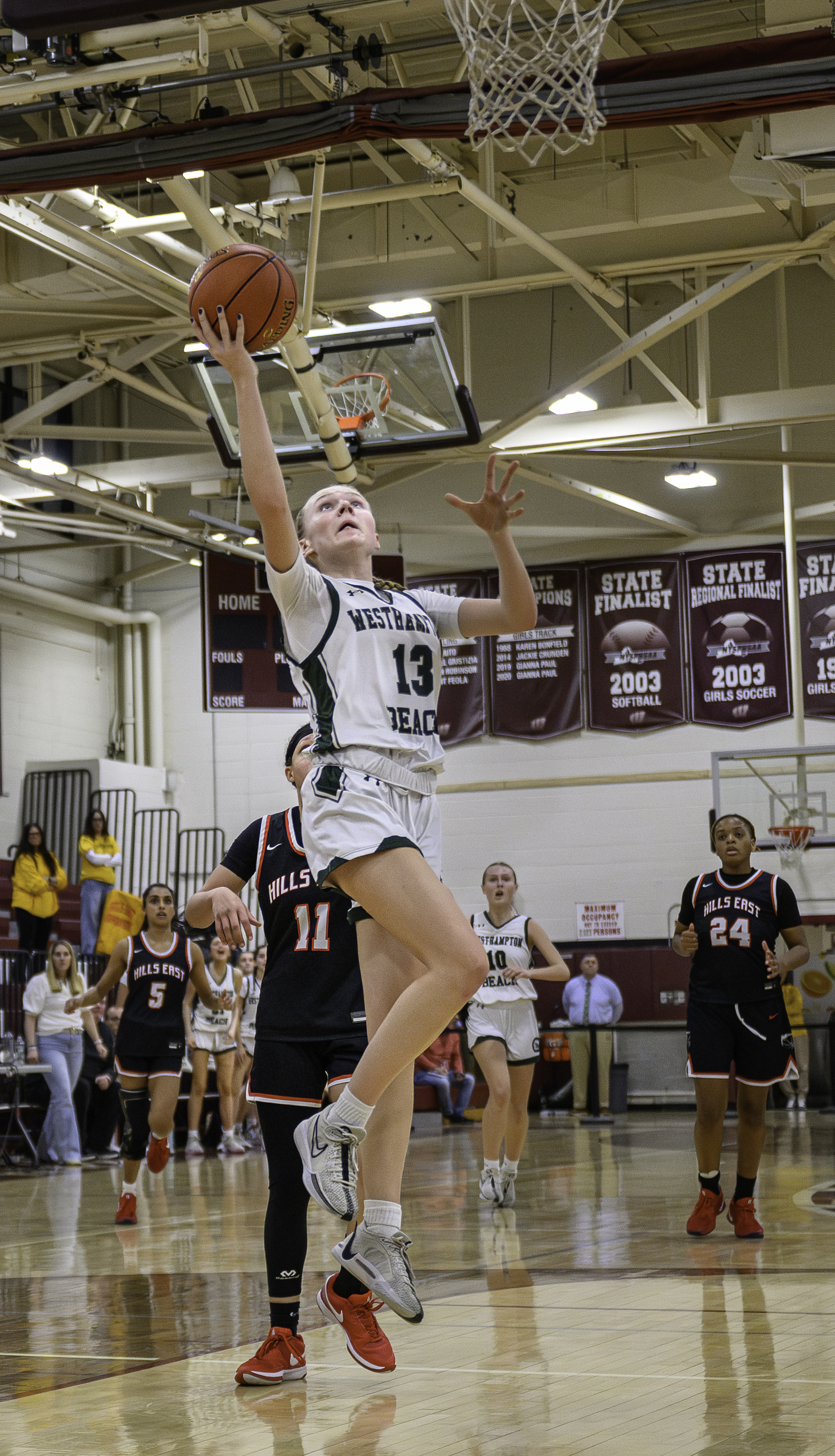 Sophomore guard Kate Sweet scores on a layup. MARIANNE BARNETT