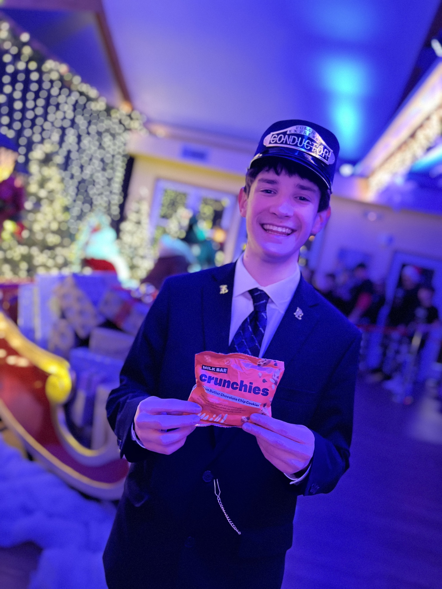 Conductors aboard the North Fork Trolley punch golden tickets and help lead the way to the North Pole with its final destination to meet Santa Claus through song and dance. Amy Fideli photo