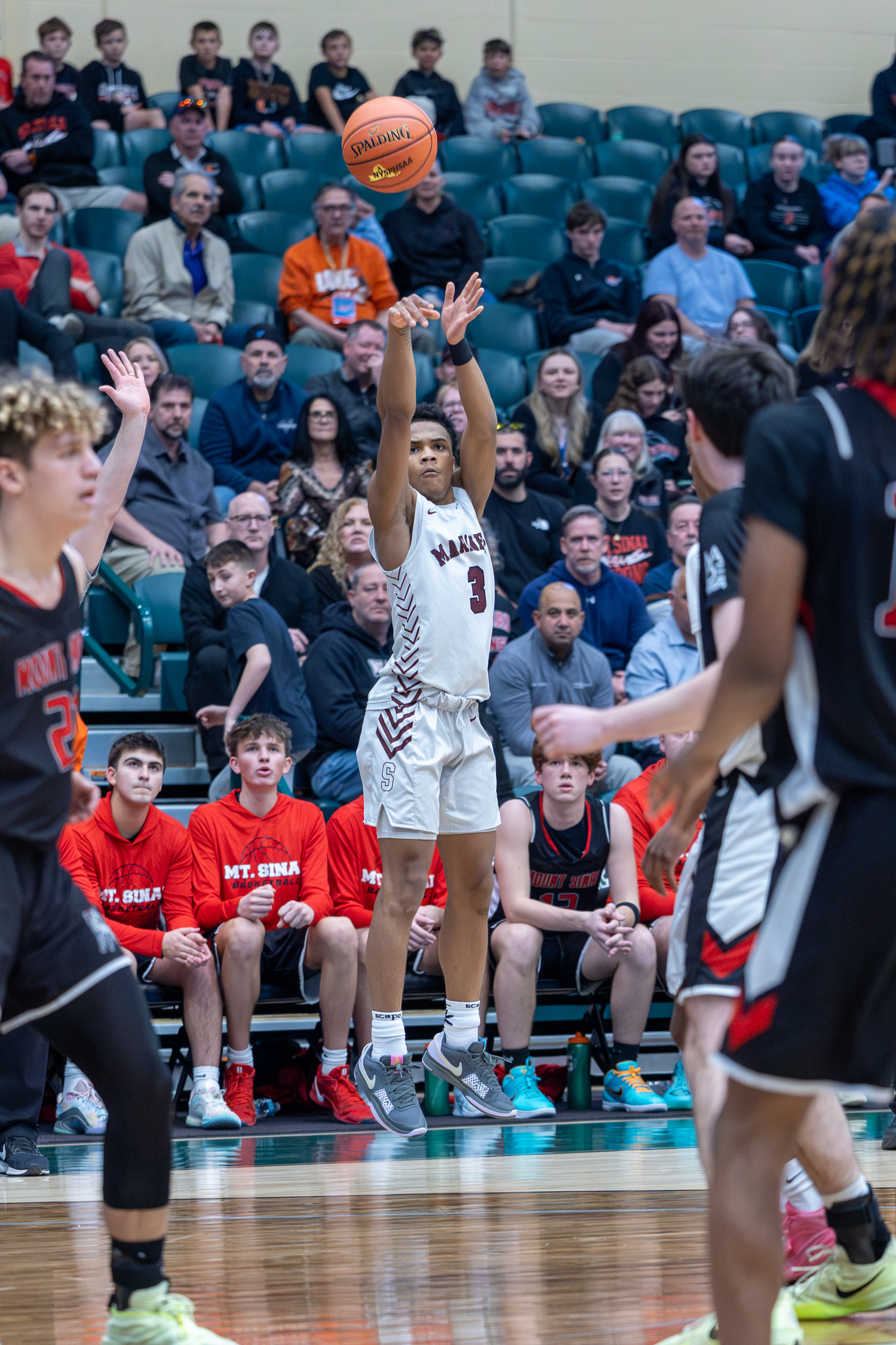 Saevion Ward shoots a three-pointer.   RON ESPOSITO