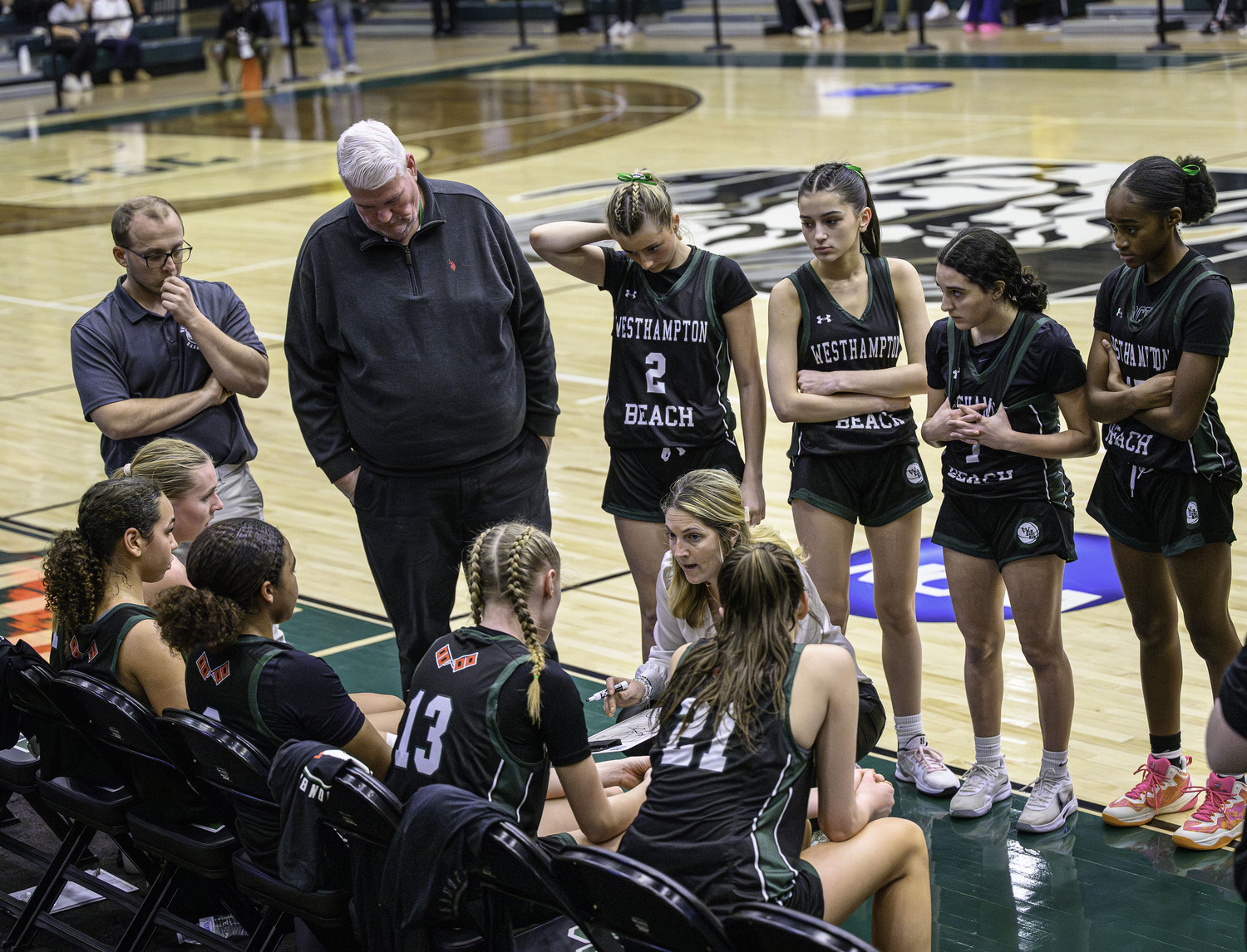 Head coach Katie Peters talks to her team during a timeout late in the fourth quarter. MARIANNE BARNETT