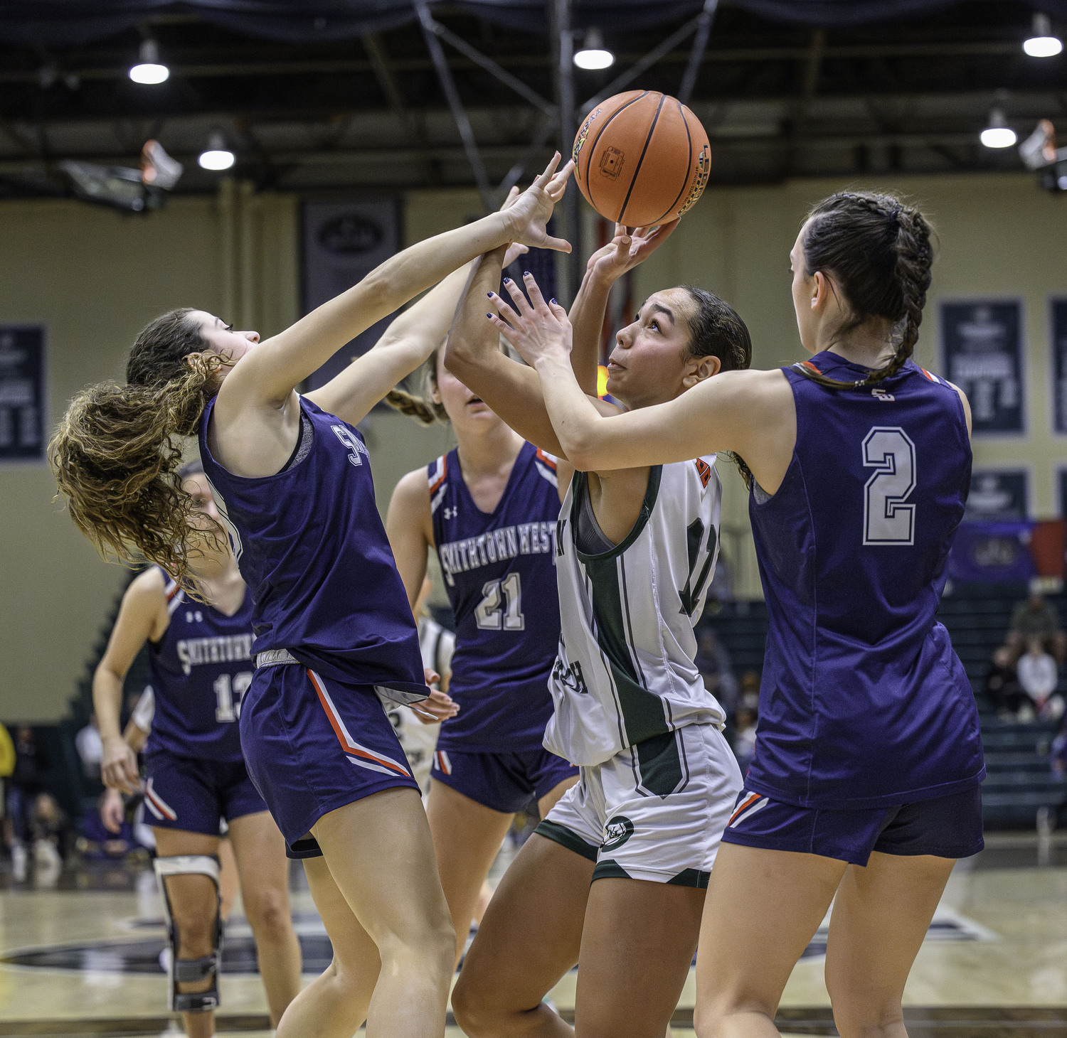 Junior center Jasmine Taylor shoots through traffic. MARIANNE BARNETT