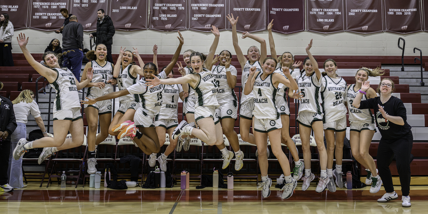 Westhampton Beach's girls basketball team members jump for joy over their second straight trip to the Suffolk County Championship game. MARIANNE BARNETT