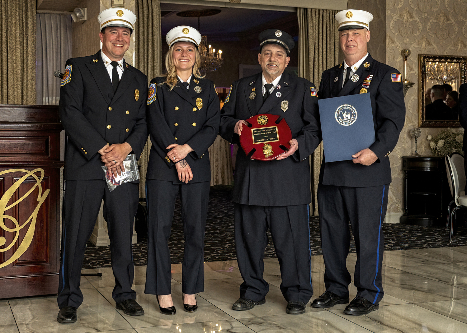 Lieutenant Philip Tortorice, third from left,  was named 2024 Firefighter of the Year of the Eastport Fire Department at the department's recent award's diner. With him are, from the left, Second Assistant Chief Chris Hulse, First Assistant Chief Virginia Haughn, and Chief John Dalen.  COURTESY EASTPORT FIRE DEPARTMENT