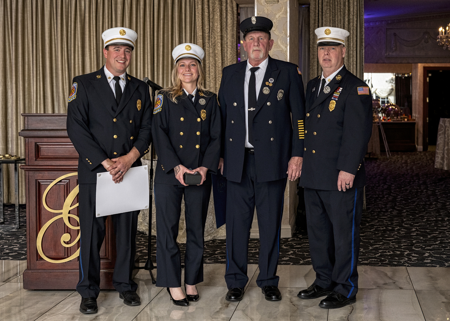 Todge Nowakowski, third from left, was honored for his fifty years of service to the Eastport Fire Department at the department's recent awards dinner . With him are, from the left, Second Assistant Chief Chris Hulse, First Assistant Chief Virginia Haughn and Chief John Dalen. COURTERSY EASTPORT FIRE DEPARTMENT