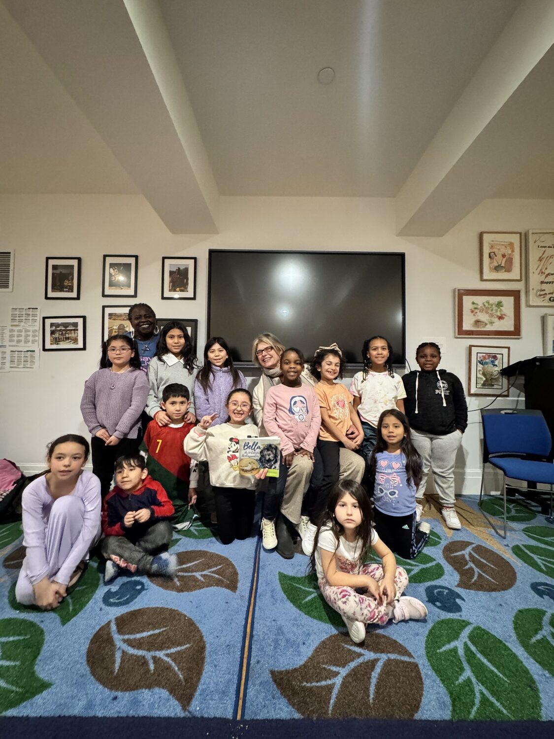 Suffolk County Legislator Ann Welker recently visited the Bridgehampton Child Care & Recreational Center and read to the youngest group in the center's after school program. COURTESY BRIDGEHAMPTON CHILD CARE & RECREATIONAL CENTER