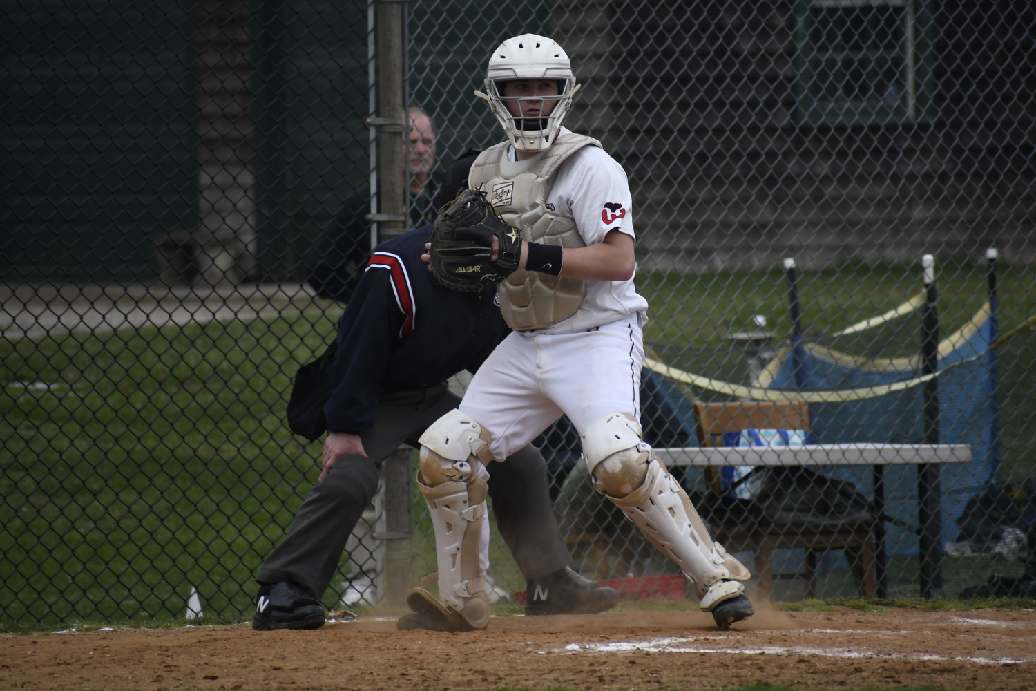 Pierson catcher Jeffrey Gregor keeps an eye on a Babylon base runner.   DREW BUDD