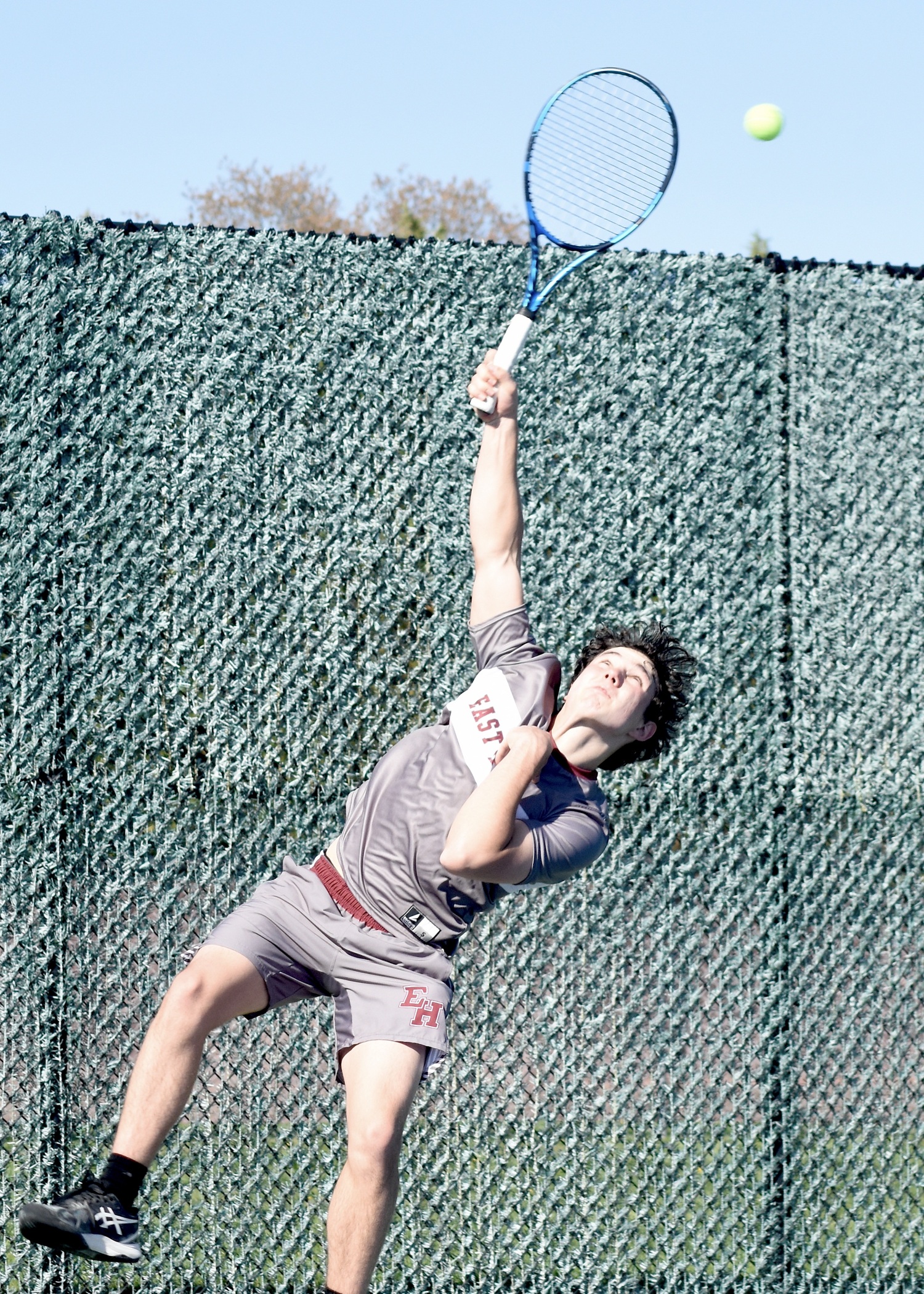 Senior Henry Cooper serves. DESIRÉE KEEGAN