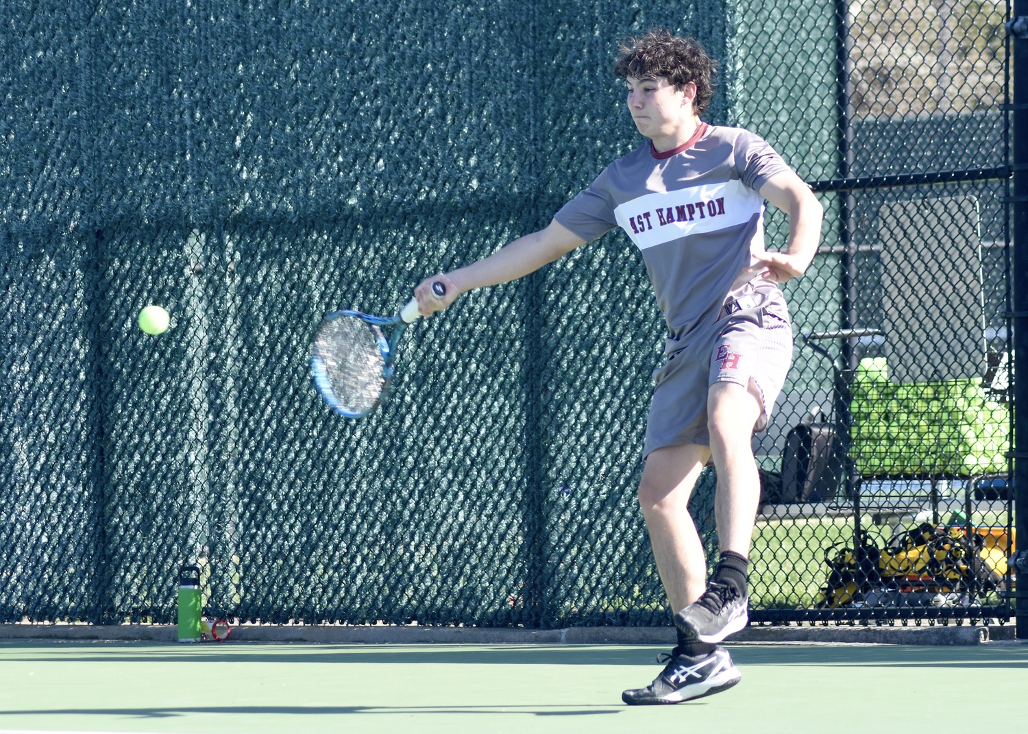 Senior Henry Cooper sends the ball back over the net. DESIRÉE KEEGAN