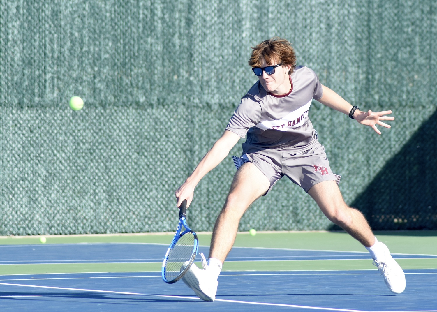 Senior Wyatt Smith reaches for a return. DESIRÉE KEEGAN
