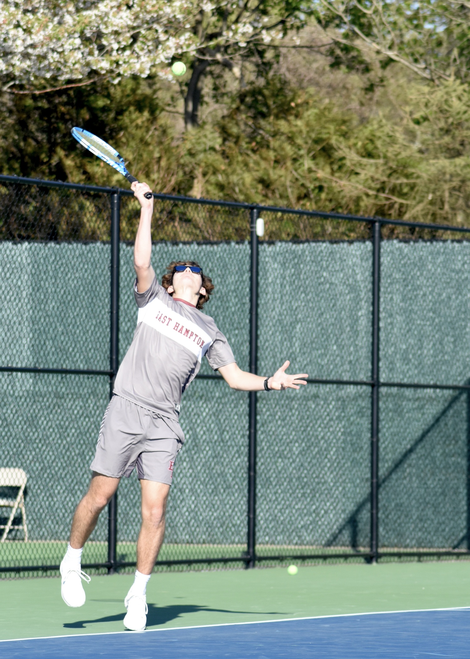 Senior Wyatt Smith serves. DESIRÉE KEEGAN