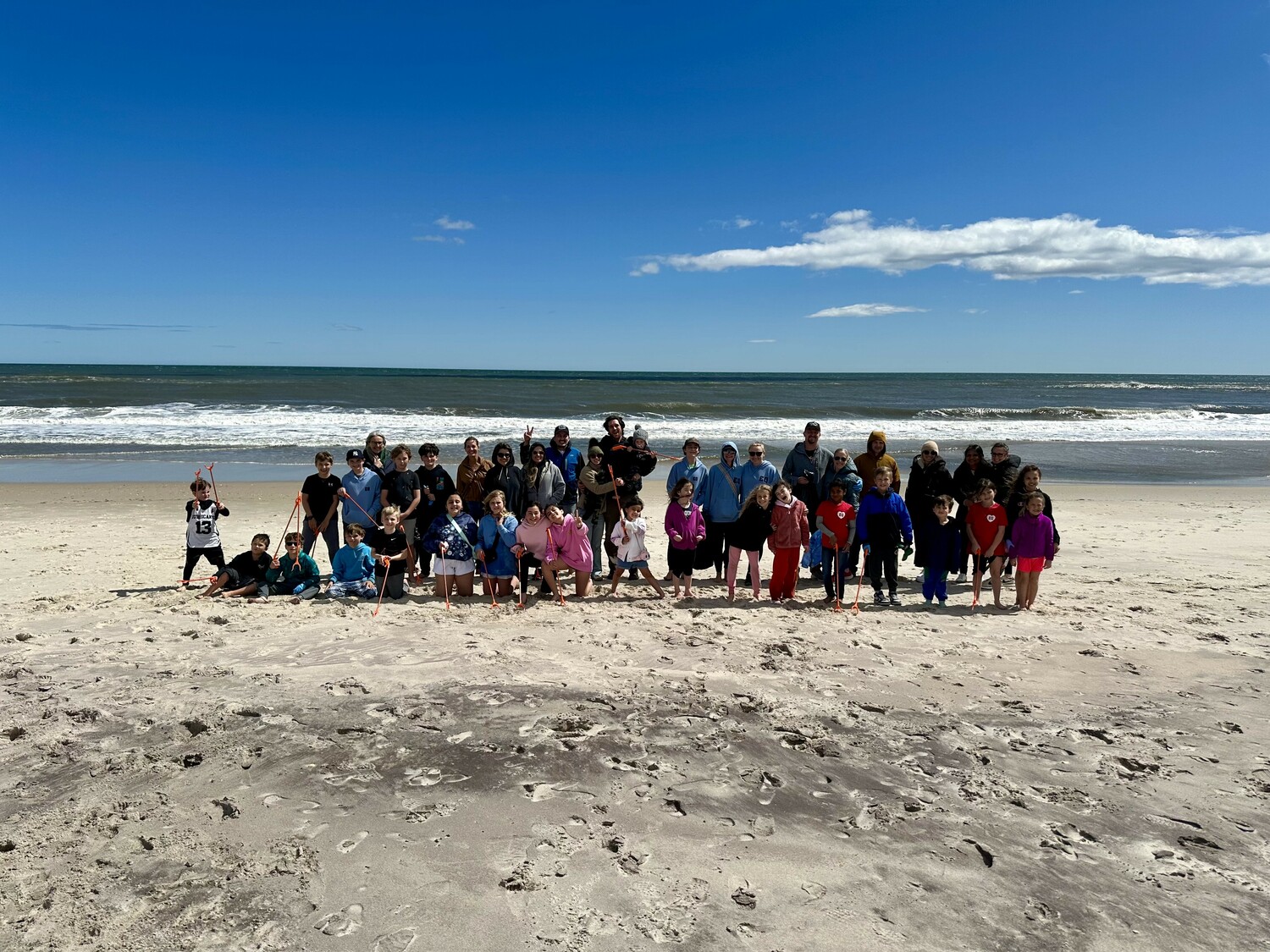 About 50 students and parents of East Quogue Elementary School supported the Great East End Clean Up on Sunday to pick up trash at Hot Dog Beach. COURTESY ANN MARIE RYBAK