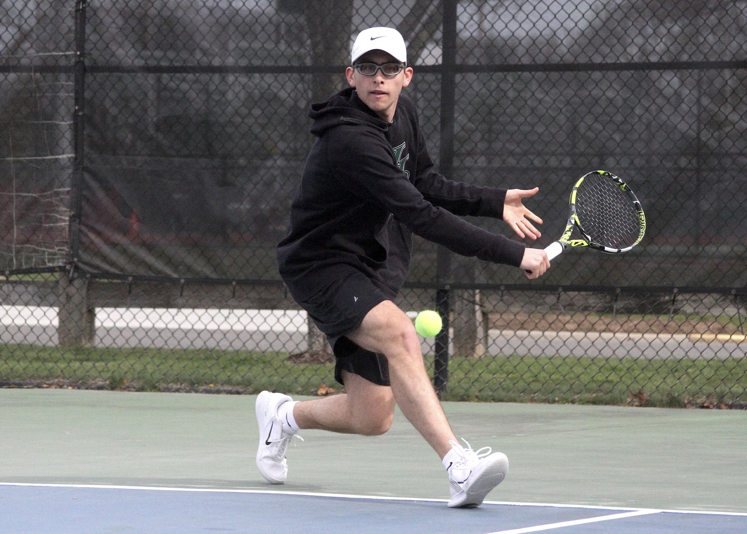 Senior Giancarlo Volpe reaches for a return. DESIRÉE KEEGAN