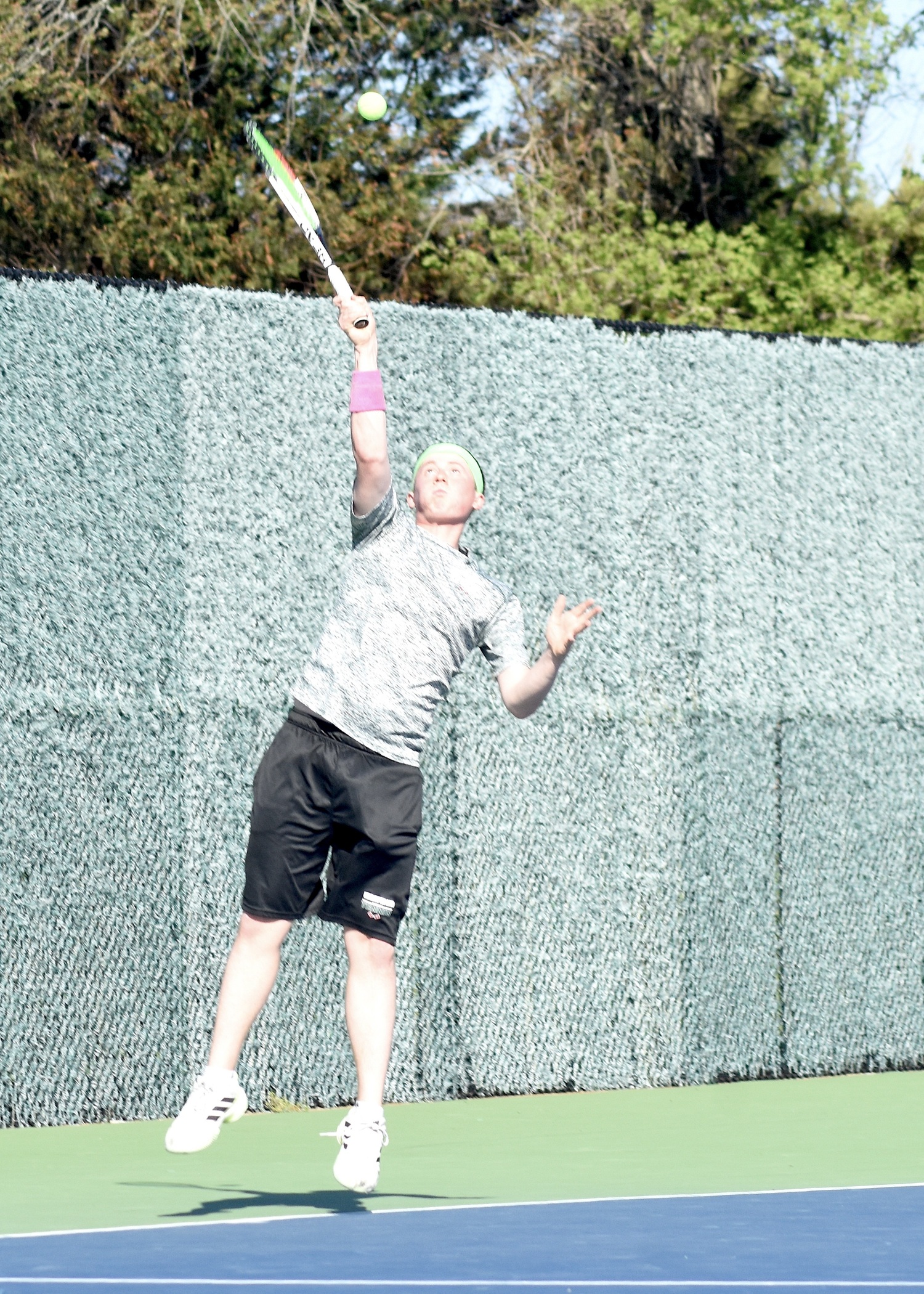 Senior Matt Moran serves. DESIRÉE KEEGAN