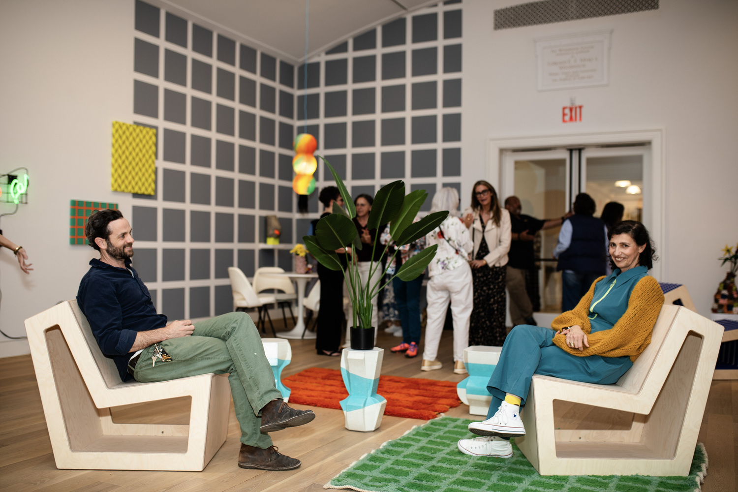 A guest with artist Almond Zigmund, right, during the May 3 opening of Zigmund's installation 