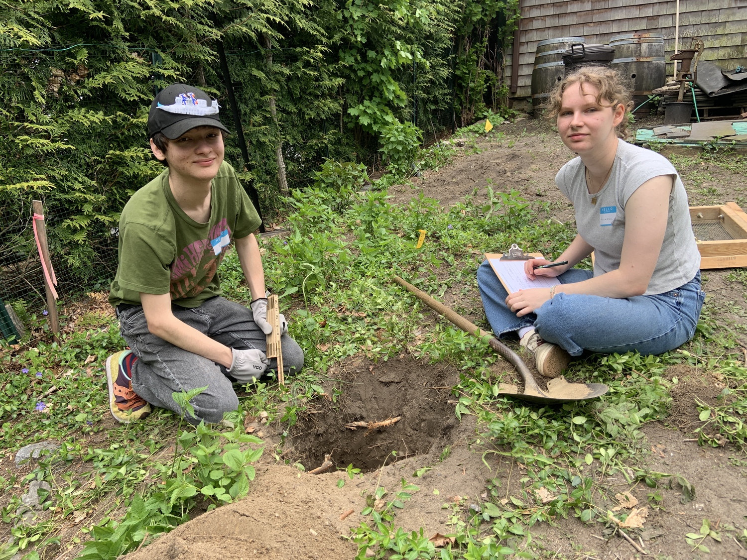 Kai Basseches, left and Annabelle Roussel, Pierson High School students who are also docents at the Annie Cooper Boyd House, helped out with the archeological dig. STEPHEN J. KOTZ