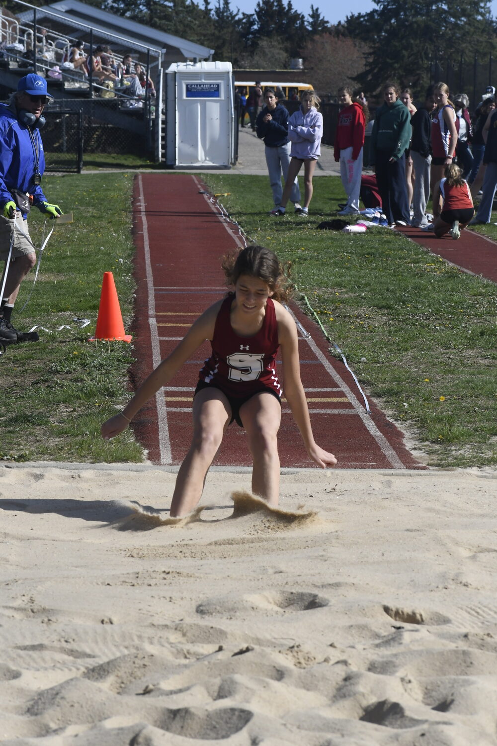 Cameron Kieffer lands in the pit with the top triple jump of the meet. DREW BUDD