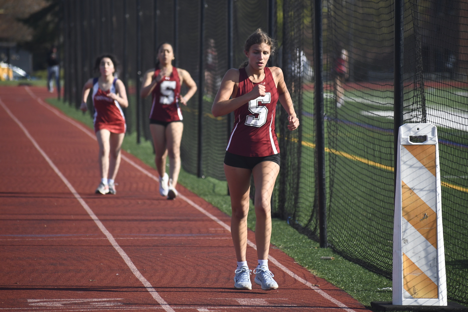 Amanda Koszalka crosses the finish line second in the 1,500-meter race walk after having fallen behind.   DREW BUDD