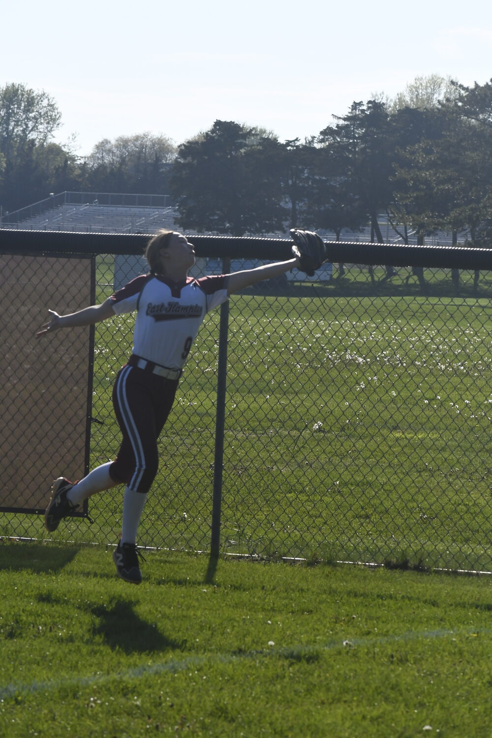 Hailey Rigby makes a catch in the right field corner.  DREW BUDD
