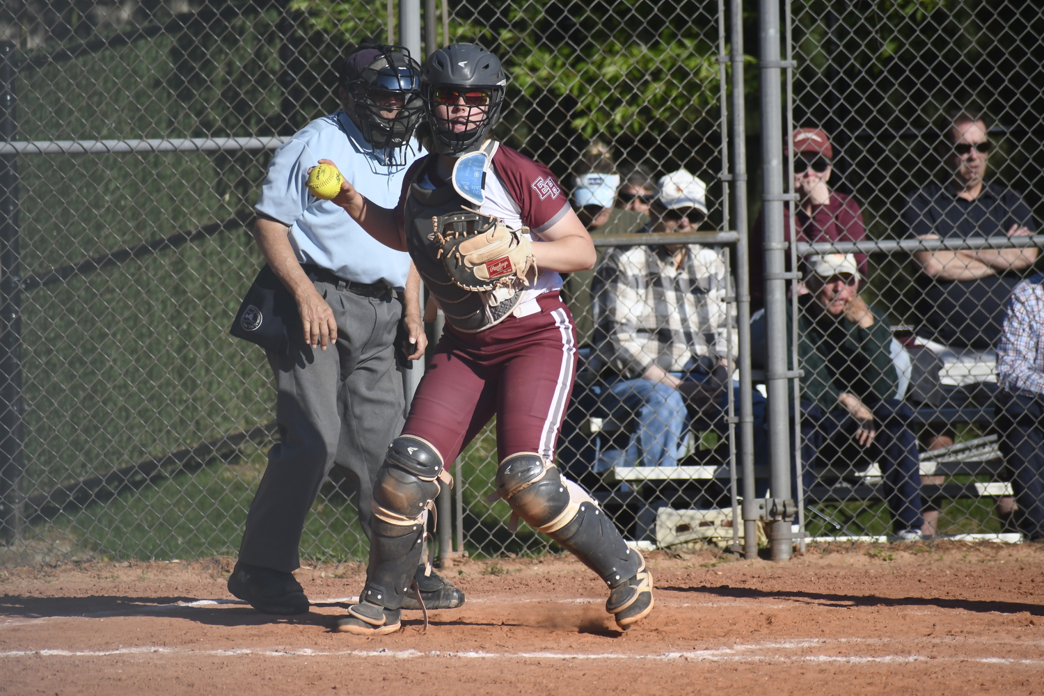Susie DiSunno keeps an eye on a Hauppauge base runner.  DREW BUDD