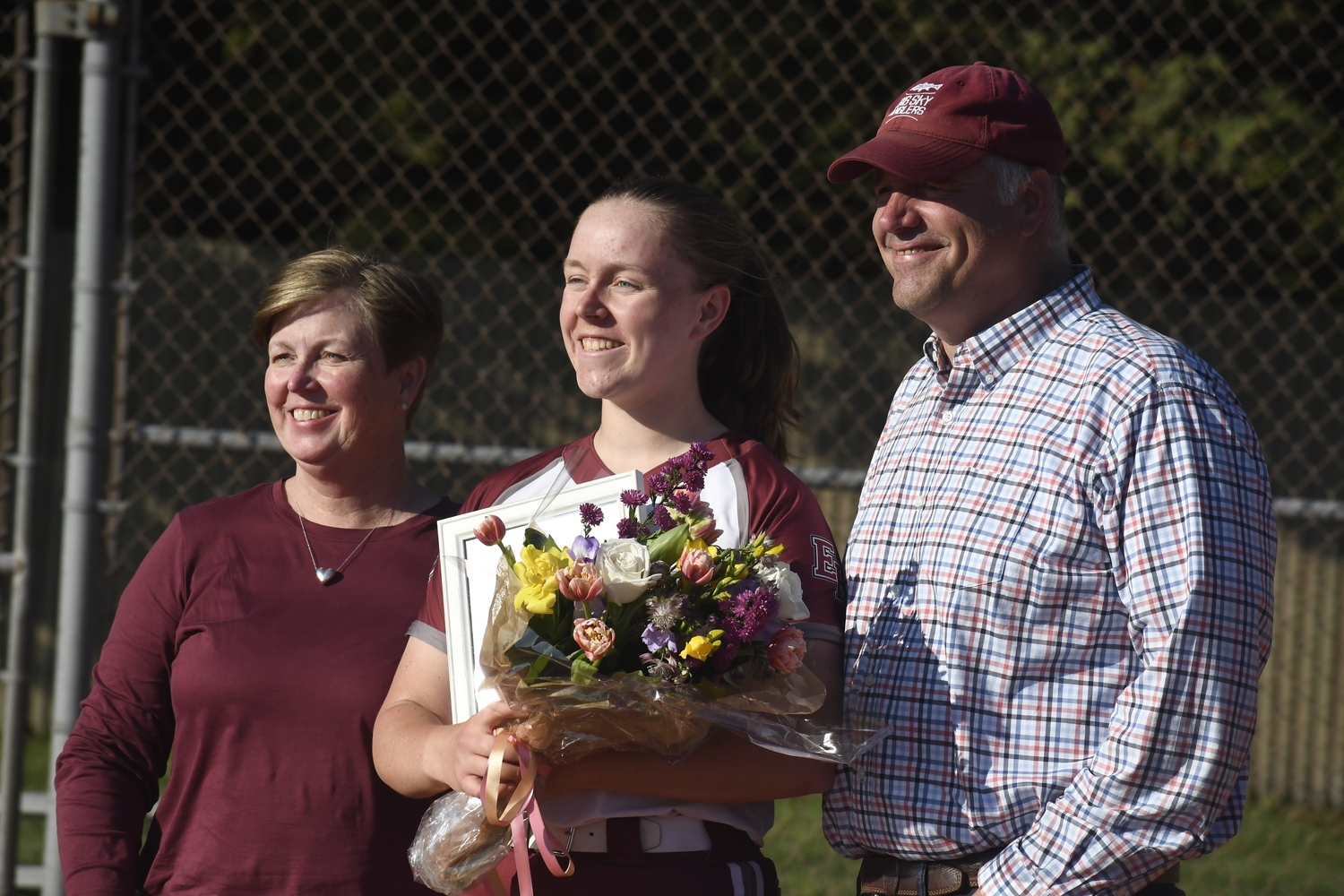 Susie DiSunno with her parents.   DREW BUDD