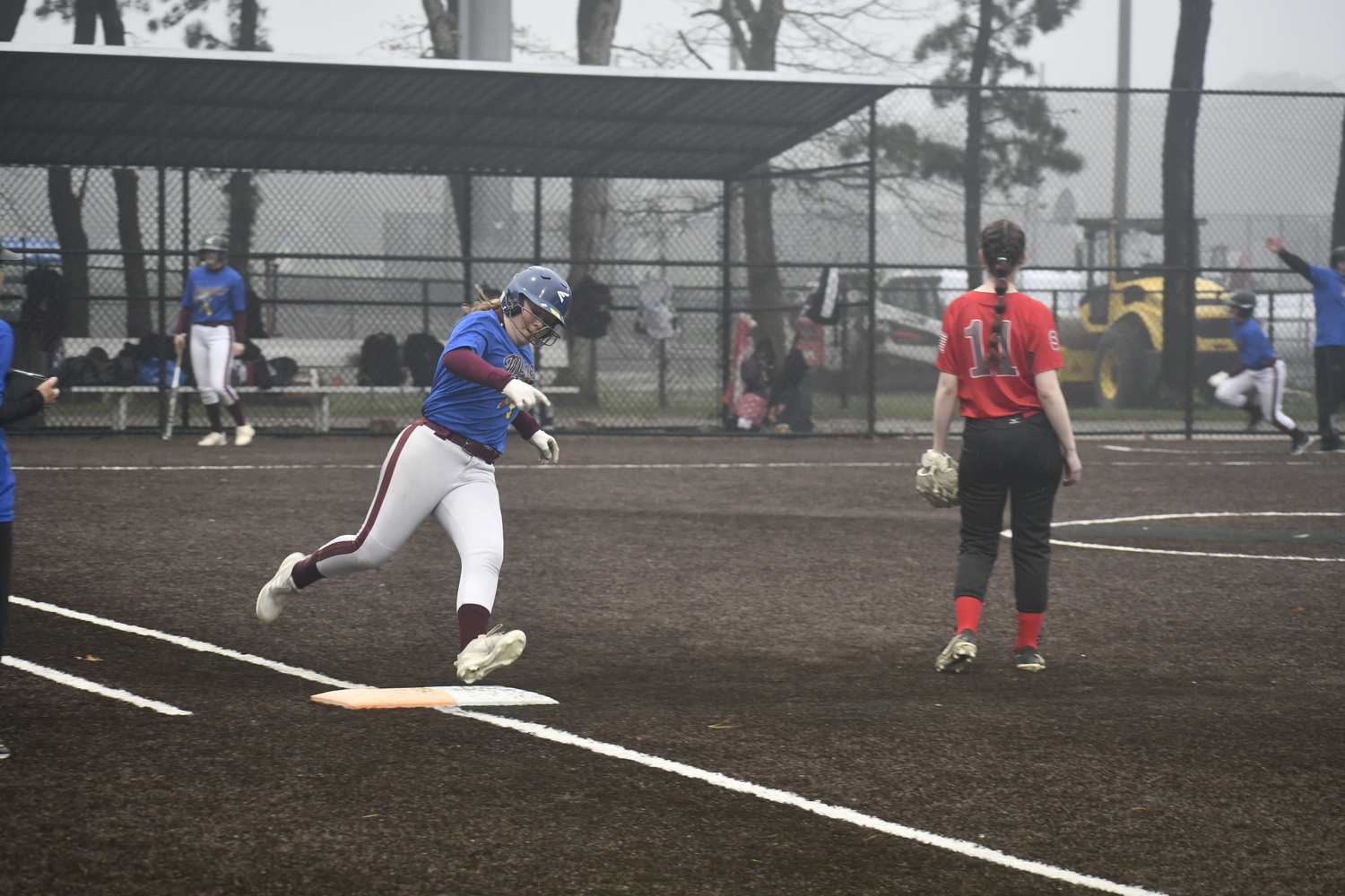 Natalie Glanz rounds first base and heads to second for a double.   DREW BUDD