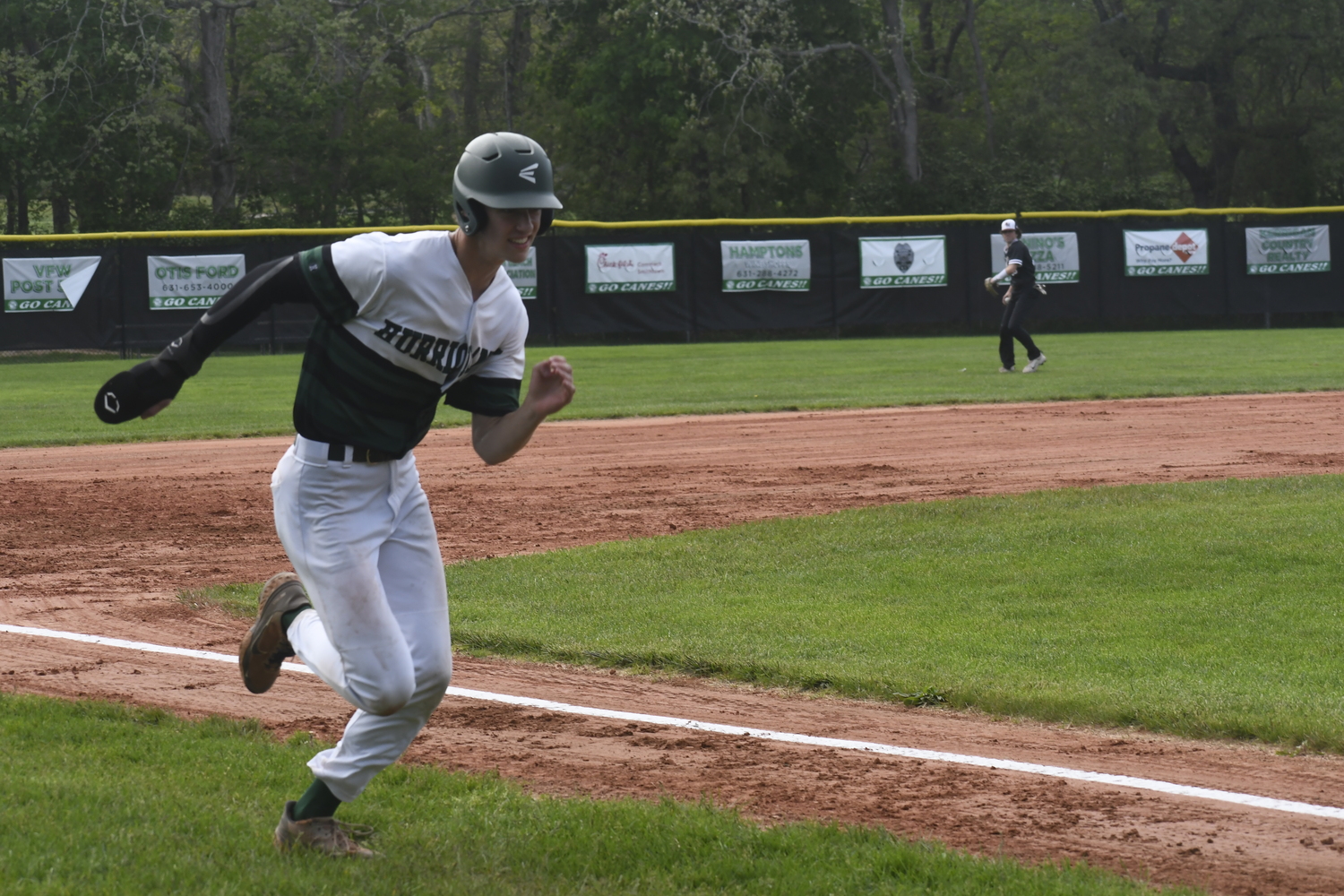 Jacob Permakoff races home to score the first run of the game on Thursday, May 15.   DREW BUDD