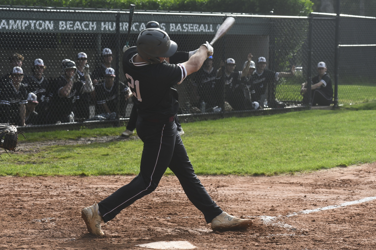 East Hampton Carter Dickinson follows through on his first home run of the season.   DREW BUDD