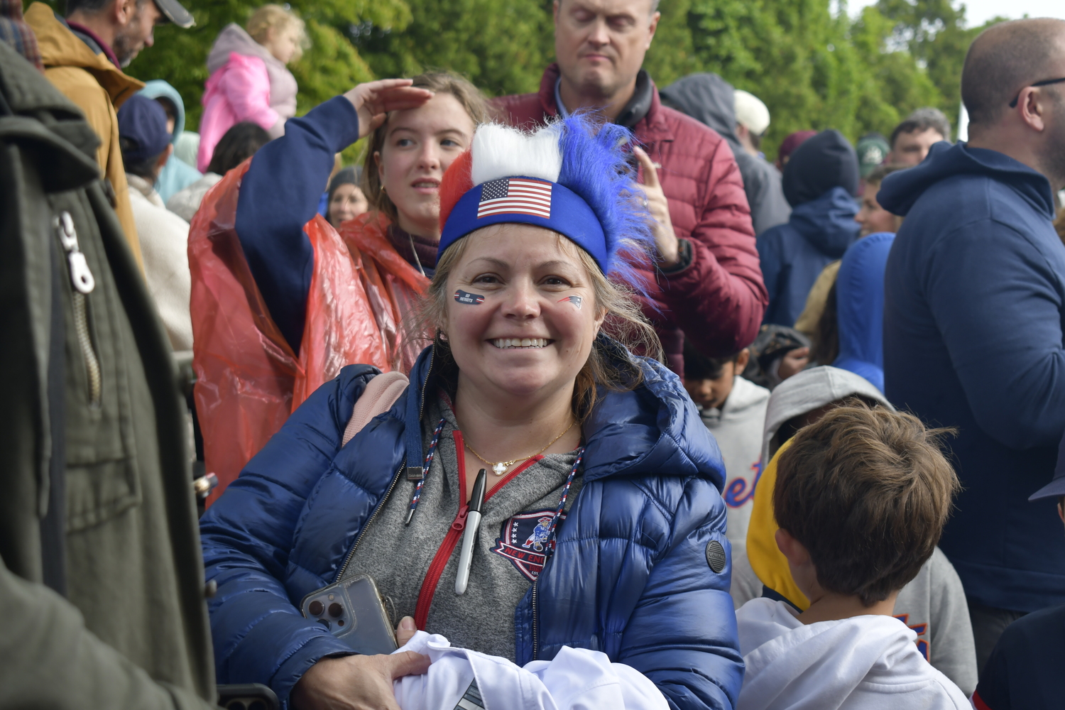 A Patriots and Tom Brady fan awaits the future Hall of Famer's arrival.   DREW BUDD